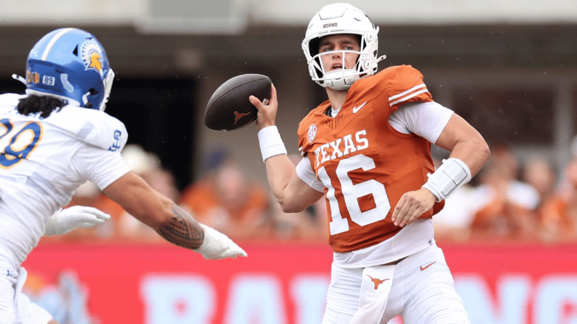 American football player holding the ball during a live play, showing the versatility of the ATH football position.
