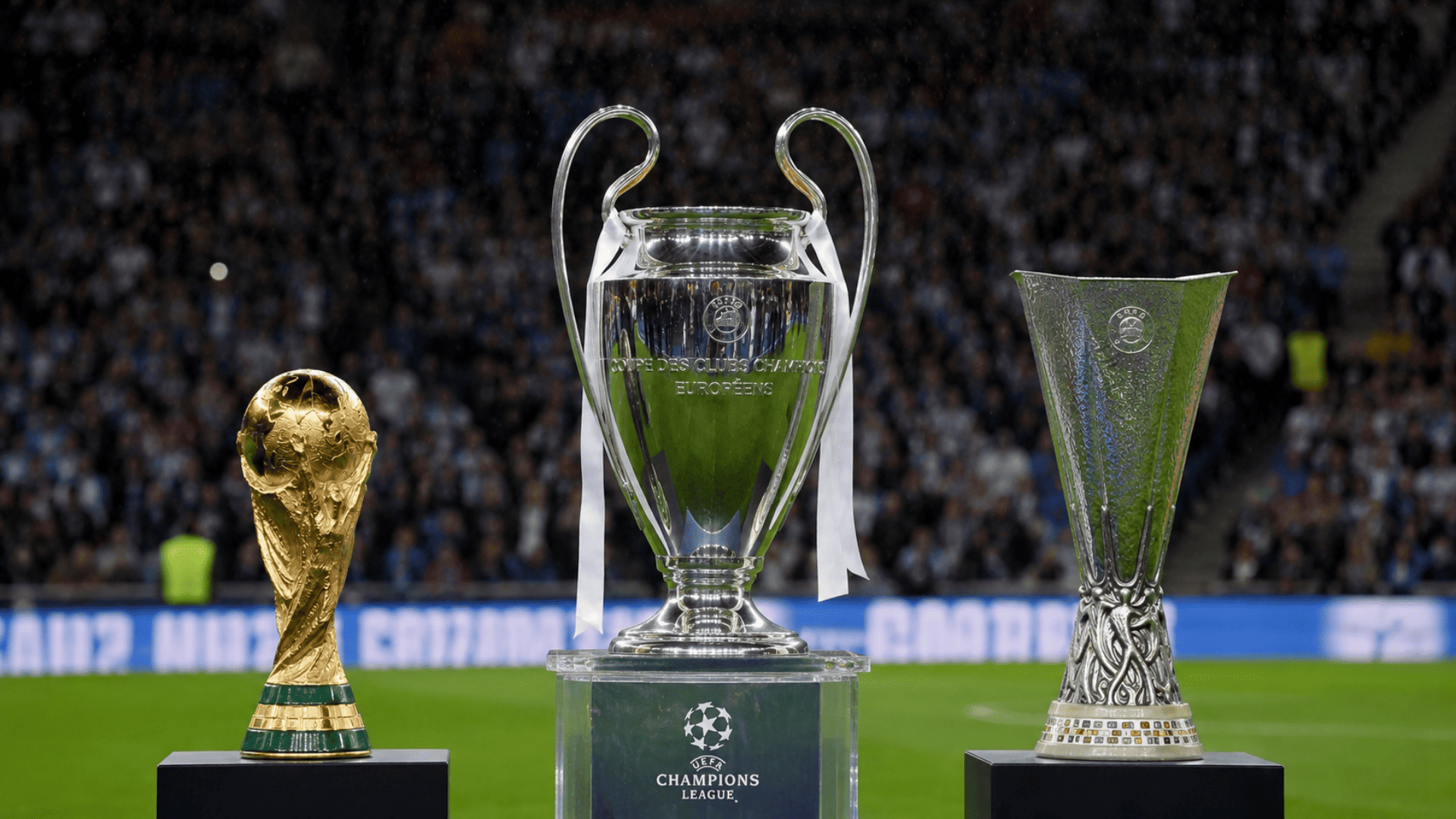 Major soccer tournament trophies displayed inside a stadium before an international football competition