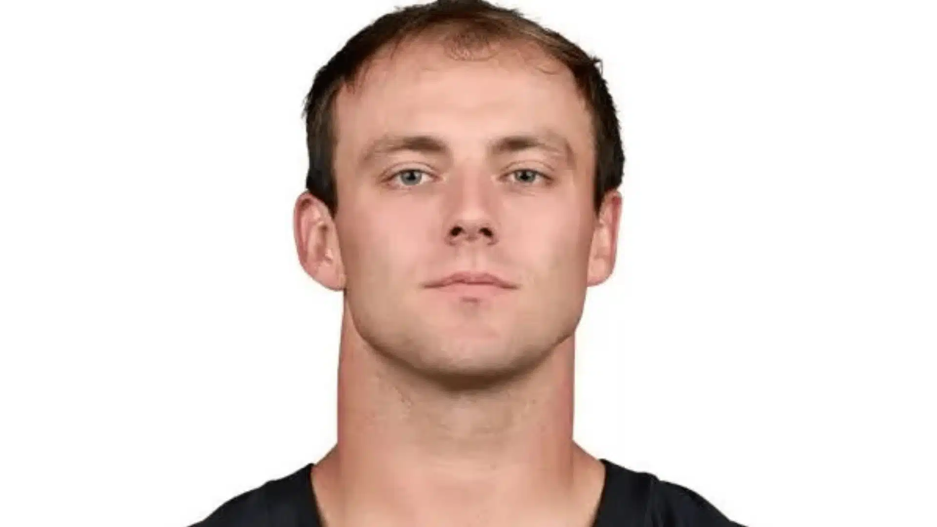 nfl headshot of raiders tight end brock bowers wearing a dark uniform against a plain white background