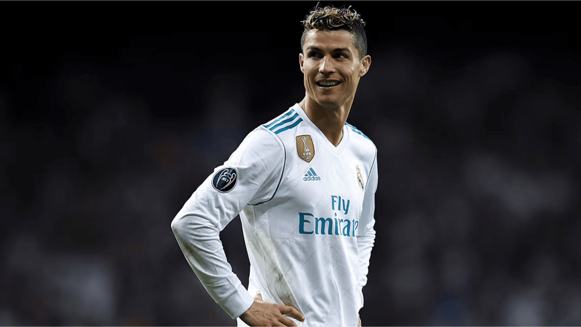 christiano ronaldo in his iconic real madrid jersey staring off in to the distance with immense aura