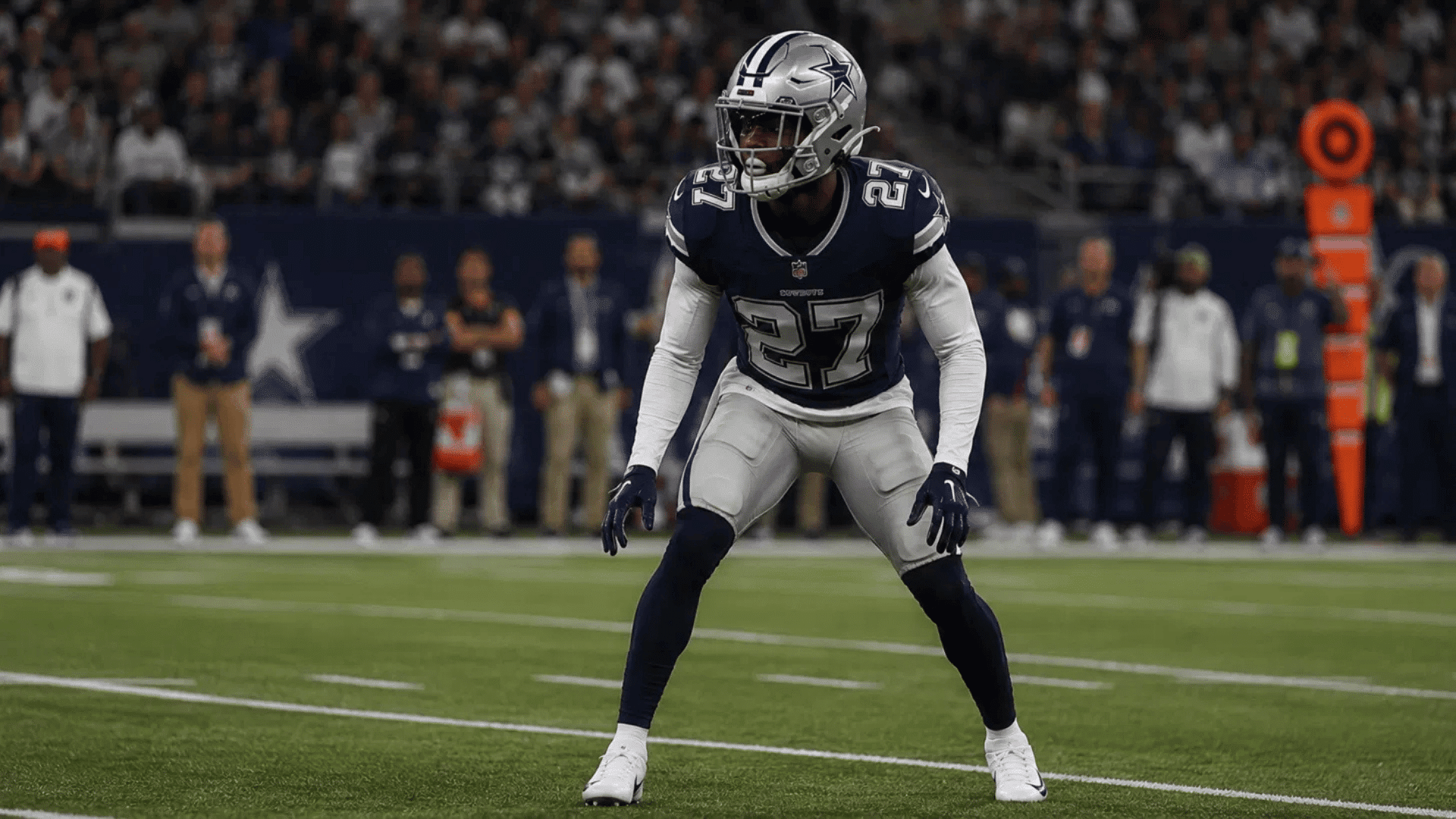 cowboys dimeback number 27 in a defensive stance ready to cover near the sideline