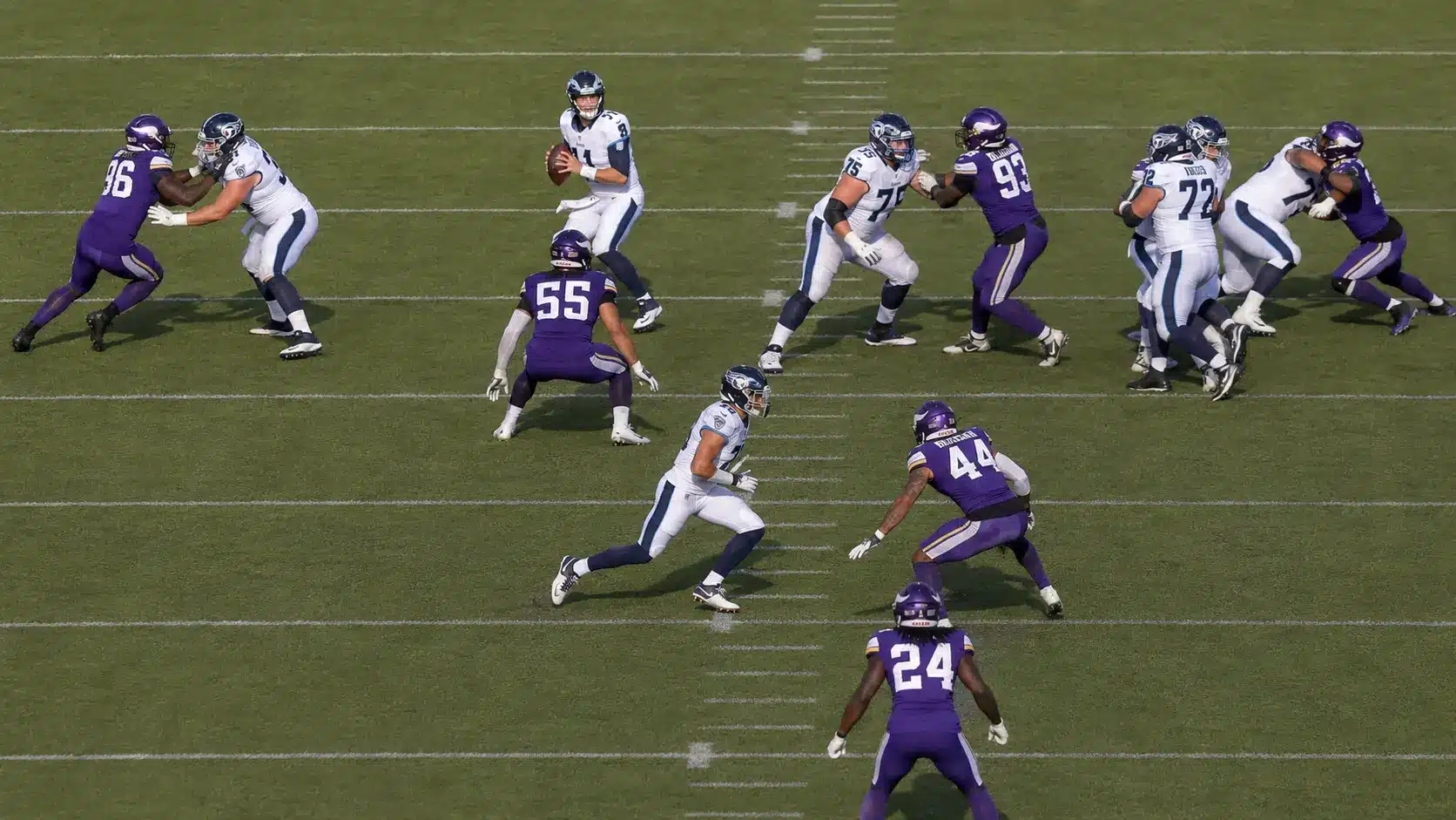 defense crowds the shallow middle as the quarterback looks for a quick drag route throw