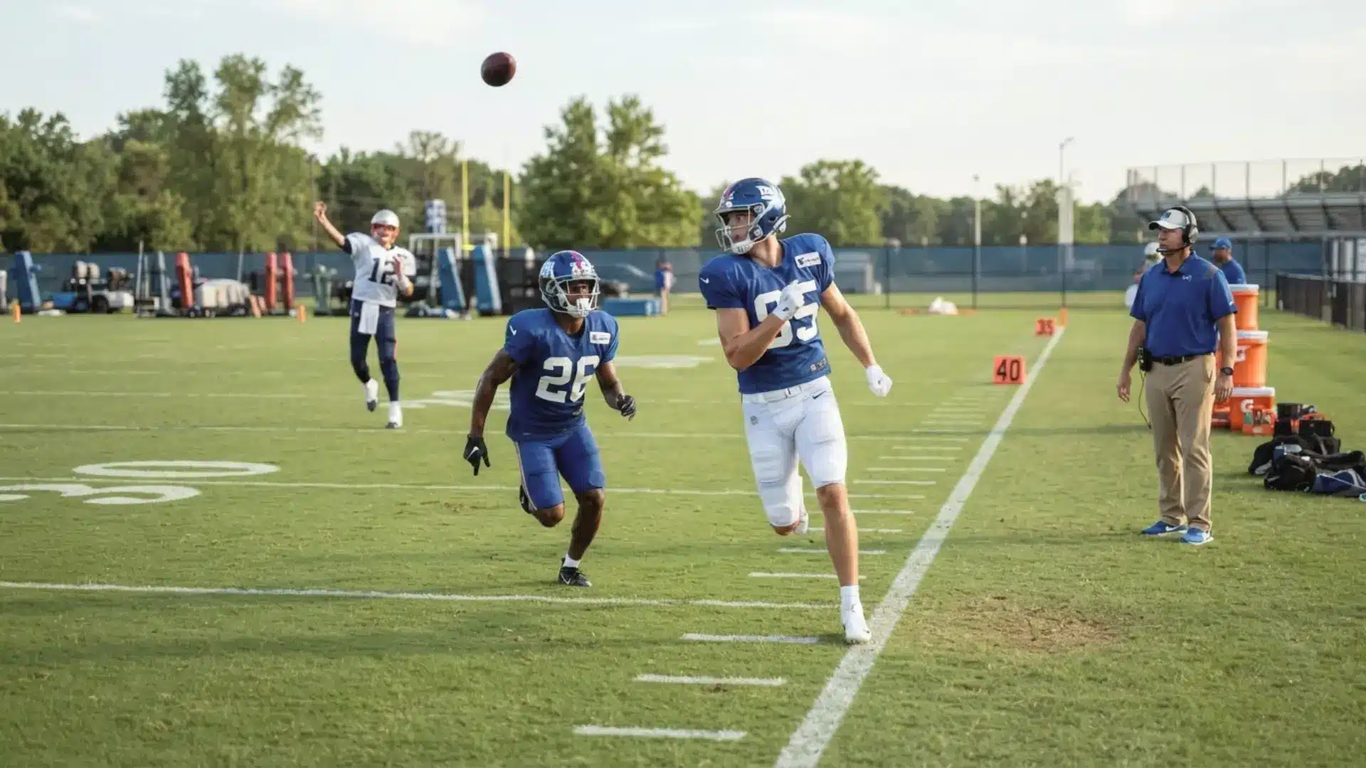 quarterback throws deep into open space as receiver runs a go route past tight coverage