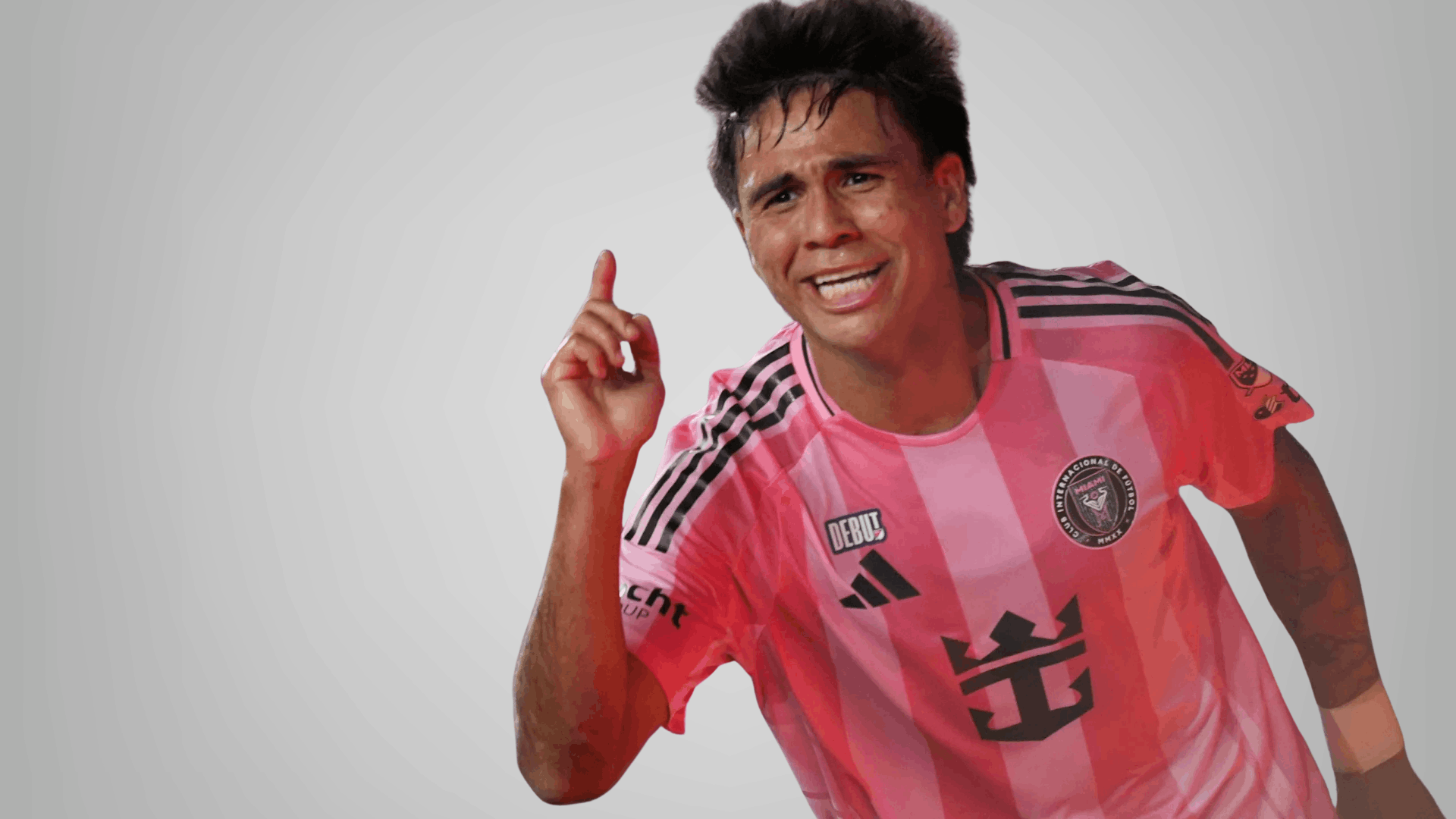 inter miami player in pink jersey smiling and pointing upward on a clean for match ratings
