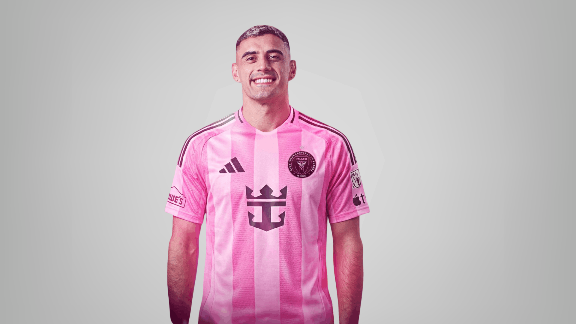 inter miami player in pink jersey smiling on a clean grey background for player ratings and match review