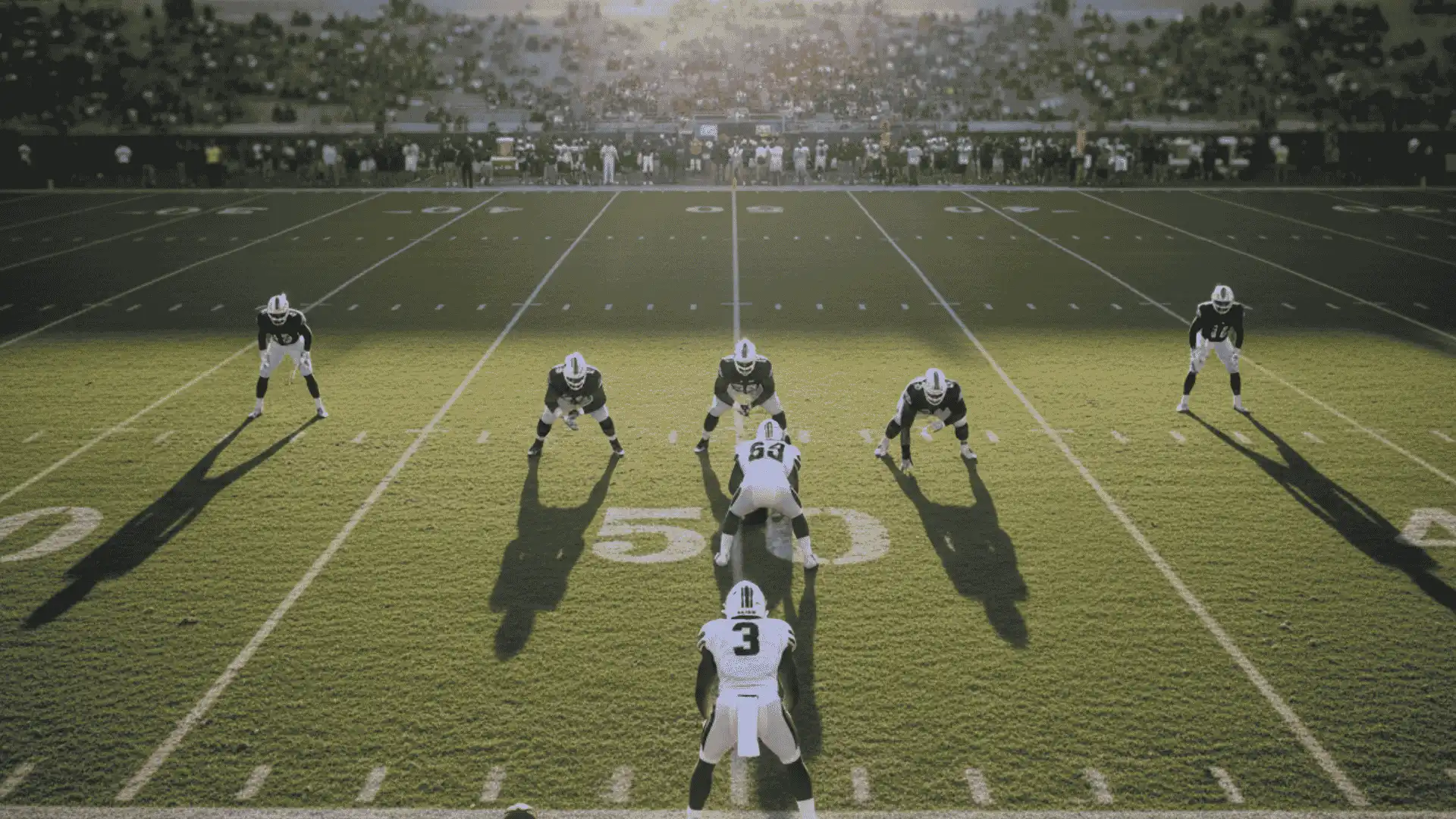 football defense players lined up before snap showing coverage formation on field during a game