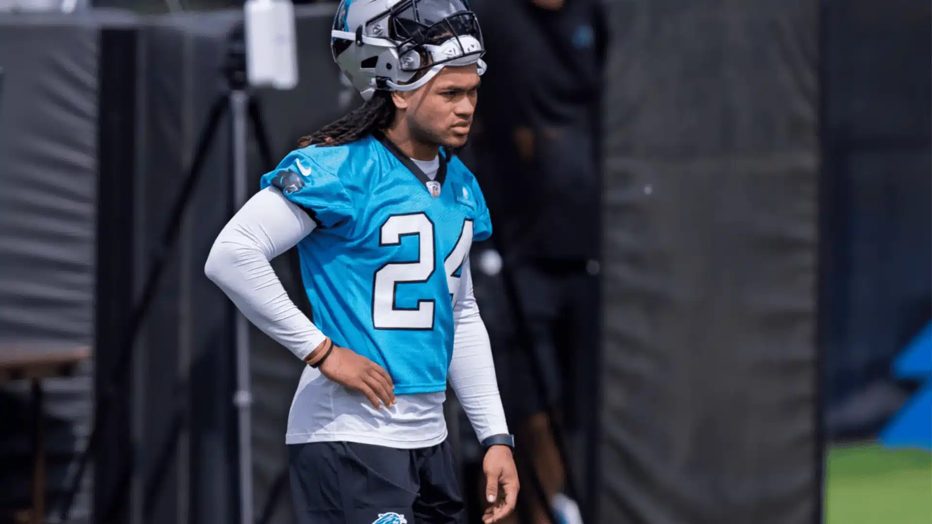 jonathon brooks wearing a carolina panthers practice jersey and helmet on the field