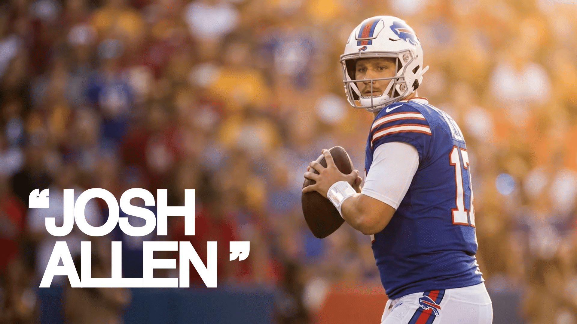 josh allen wearing his buffalo bills uniform standing tall in a game ready stance at a football stadium
