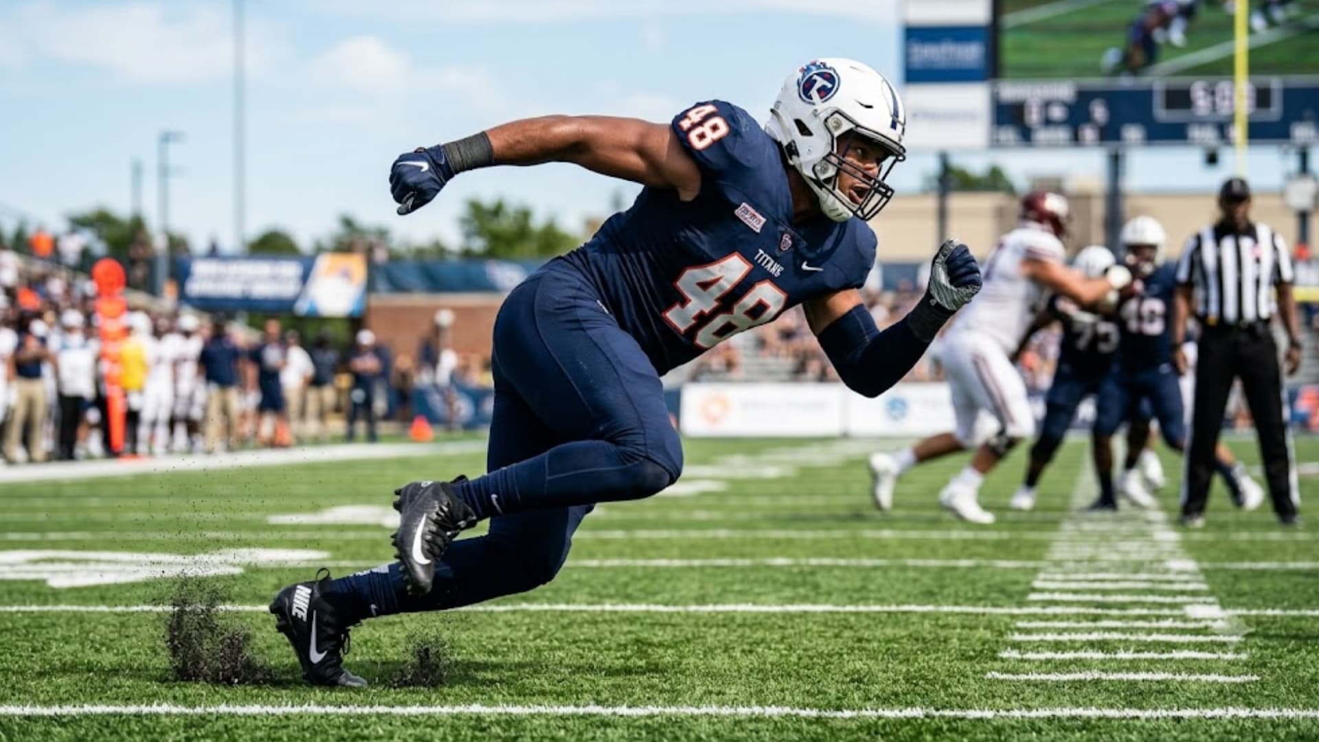 linebacker explodes off the line chasing down the ball carrier during a college football game