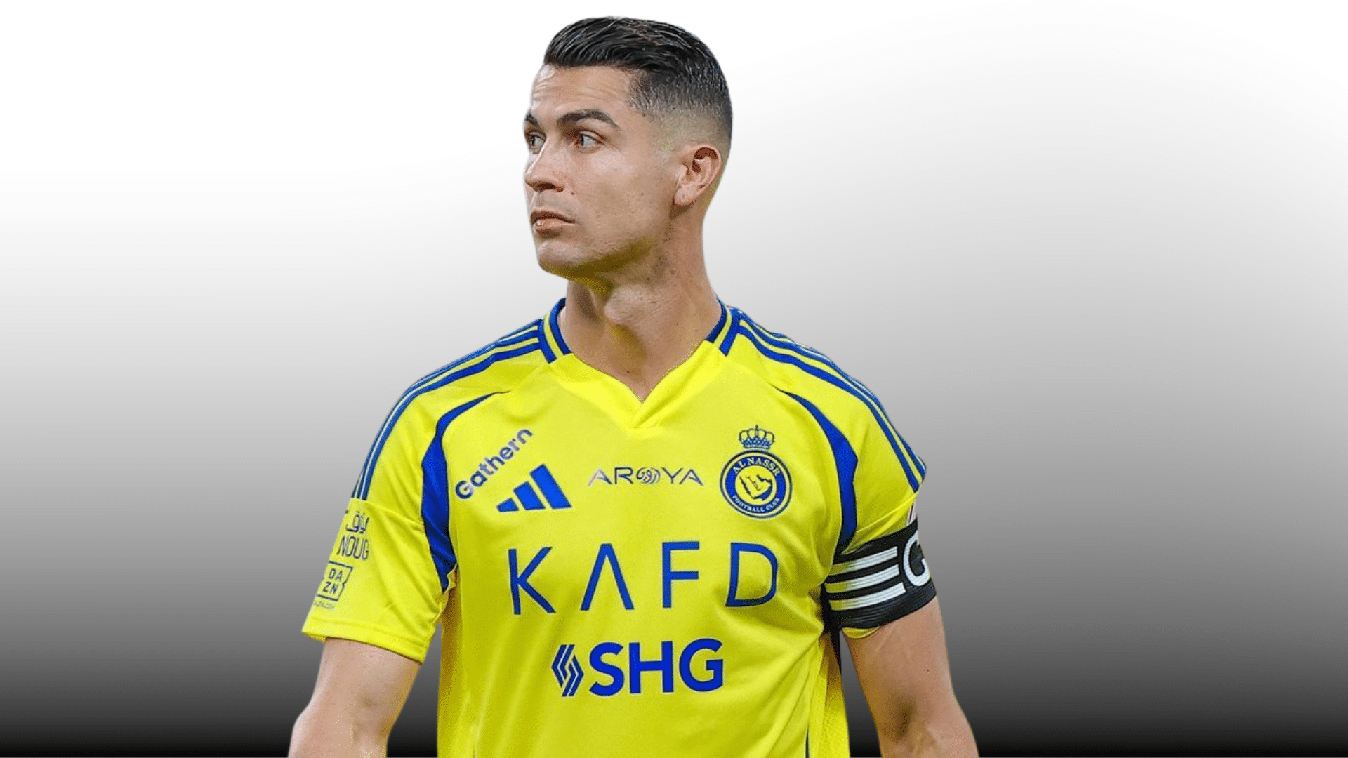 male soccer player in yellow and blue jersey with captain armband looking left on gray gradient background