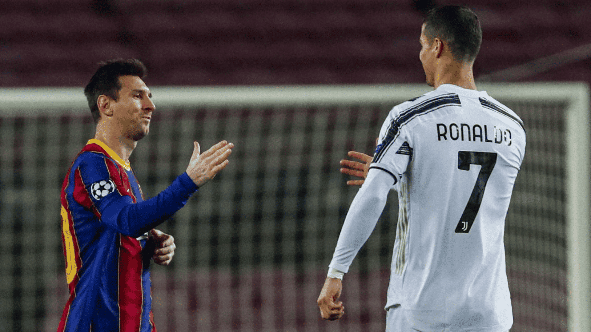 messi and ronaldo shaking hands before a soccer match with stadium lights in the background