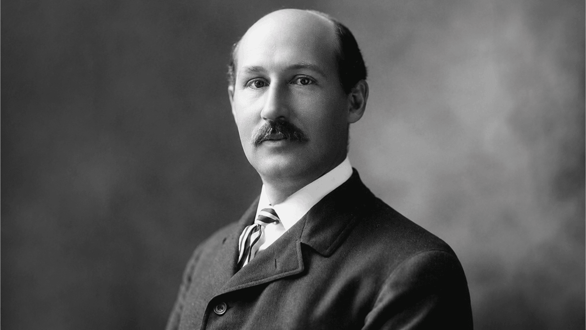 portrait of walter camp in formal attire from the late 1800s shown in a vintage black and white studio photograph