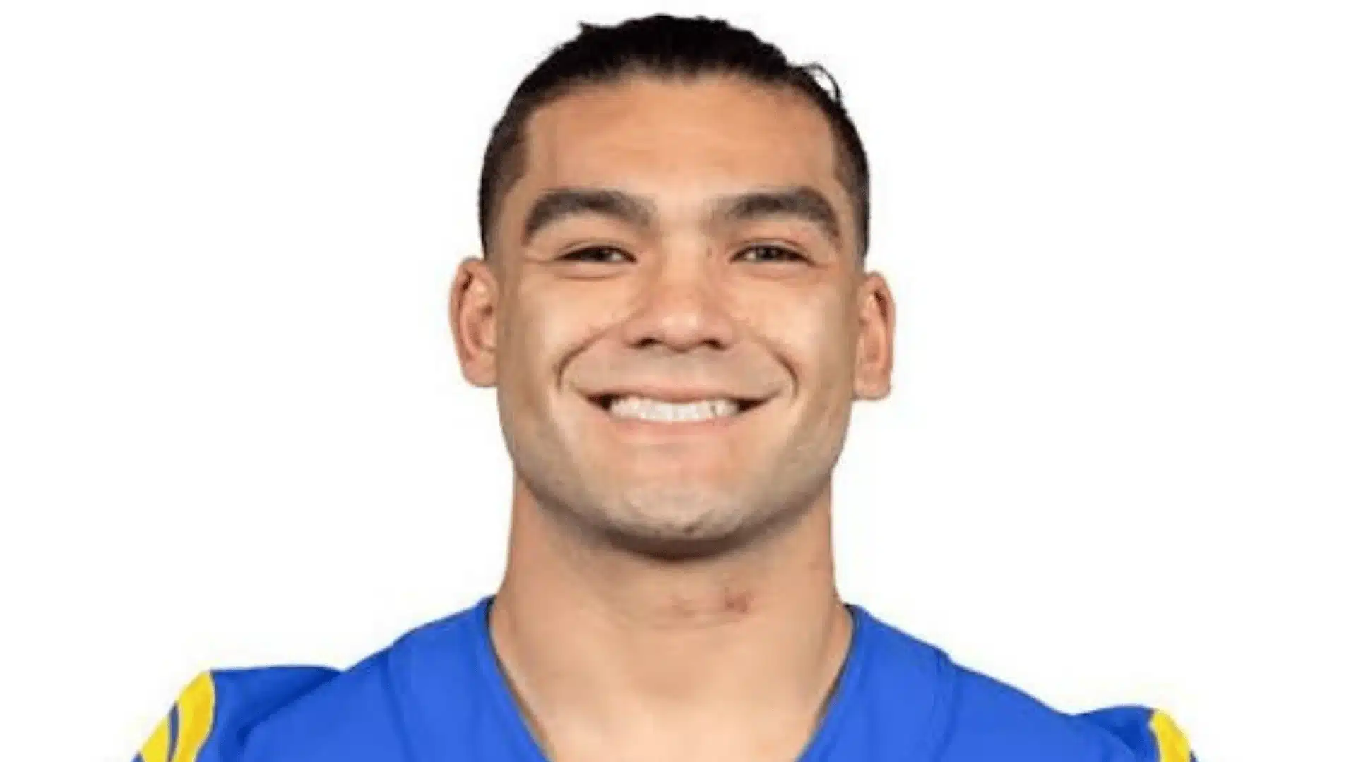 nfl headshot of los angeles rams wide receiver puka nacua smiling in a blue and yellow jersey
