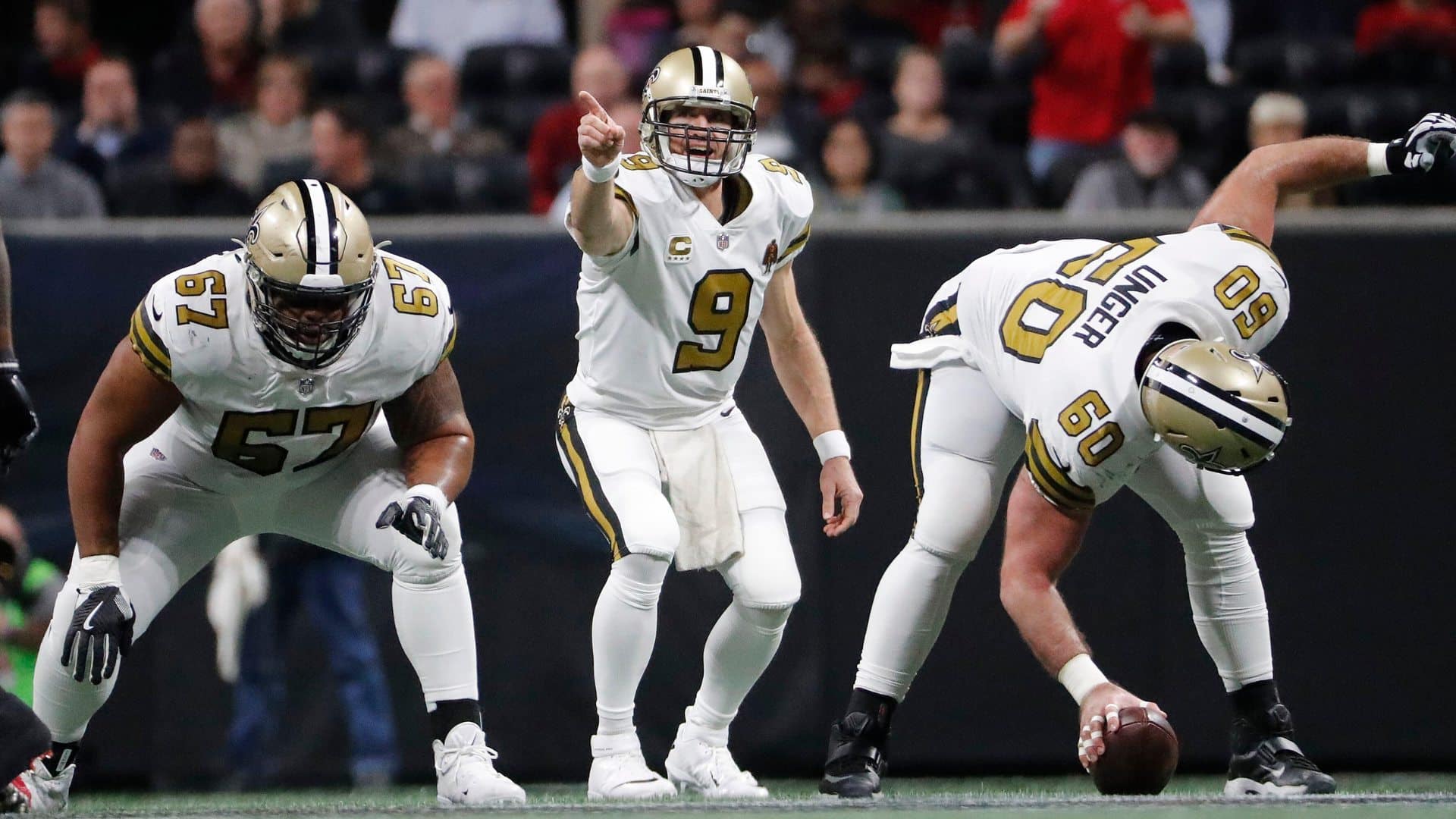 nfl quarterback pointing at the defense before the snap to identify the Mike linebacker and adjust pass protection