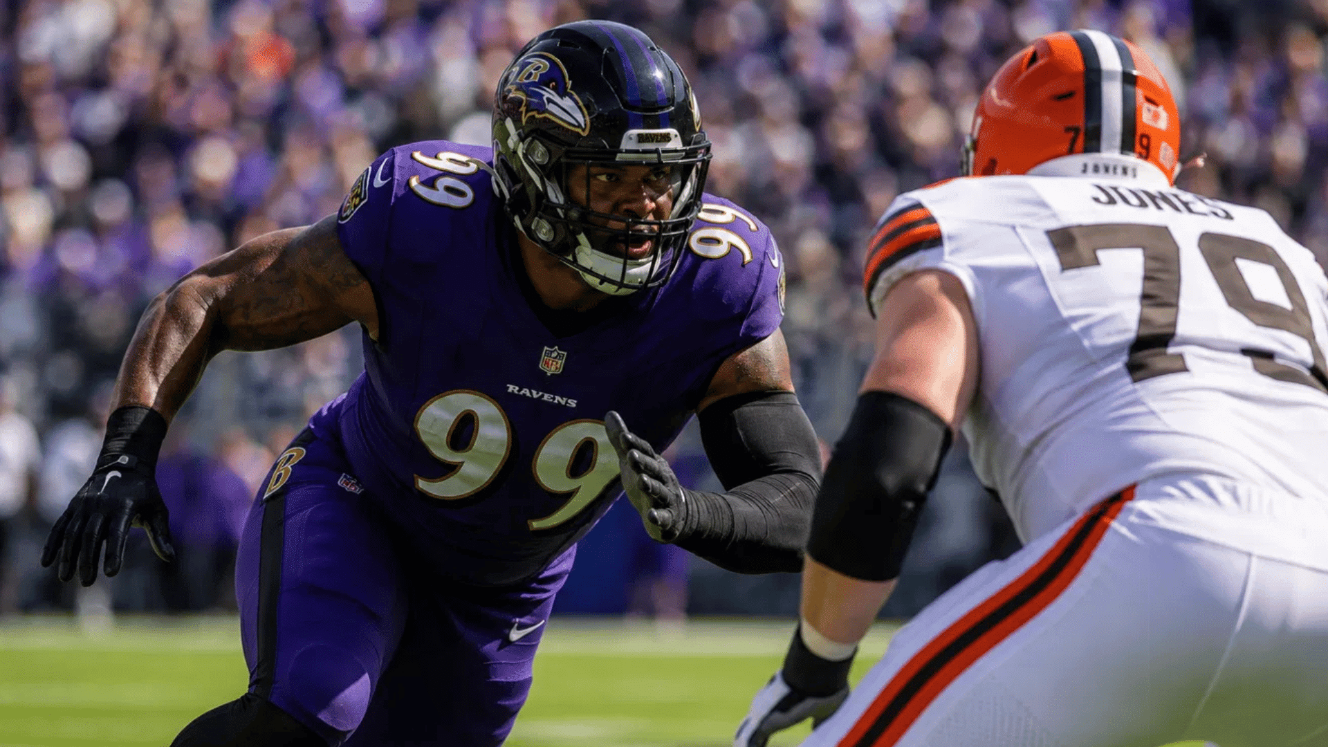 ravens edge rusher number 99 rushing off the line against browns offensive lineman jones