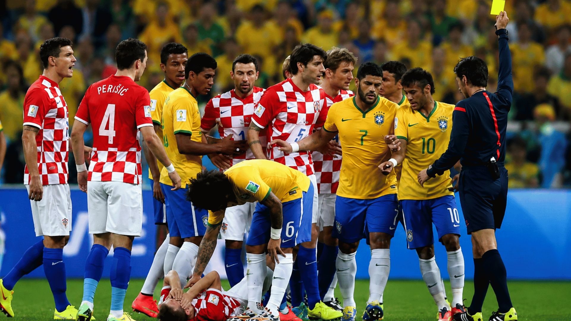 referee showing a yellow card during a heated soccer match as players gather around an injured player on the field