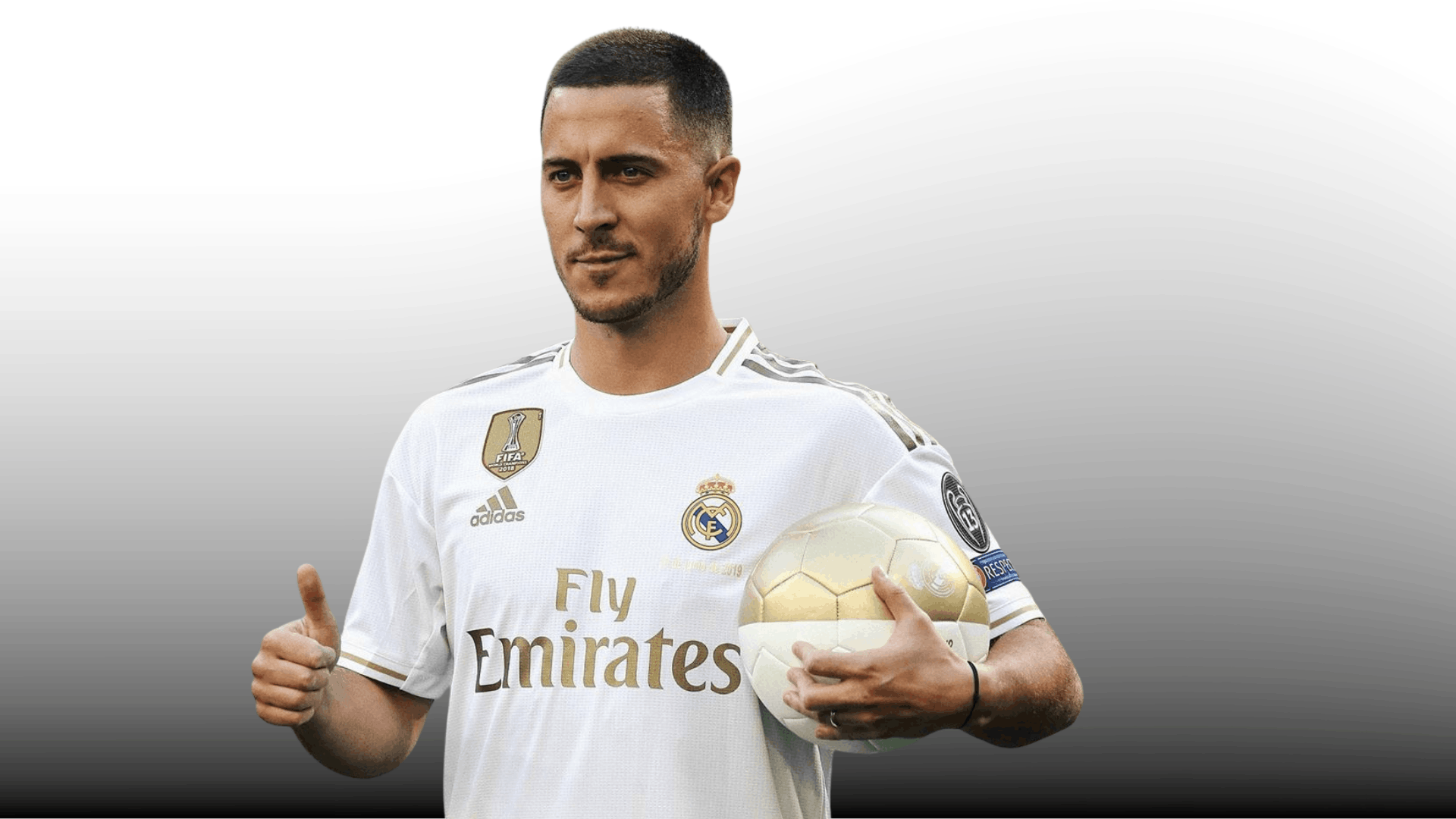 soccer player with short buzz cut holding a ball and giving thumbs up in white jersey on gray background