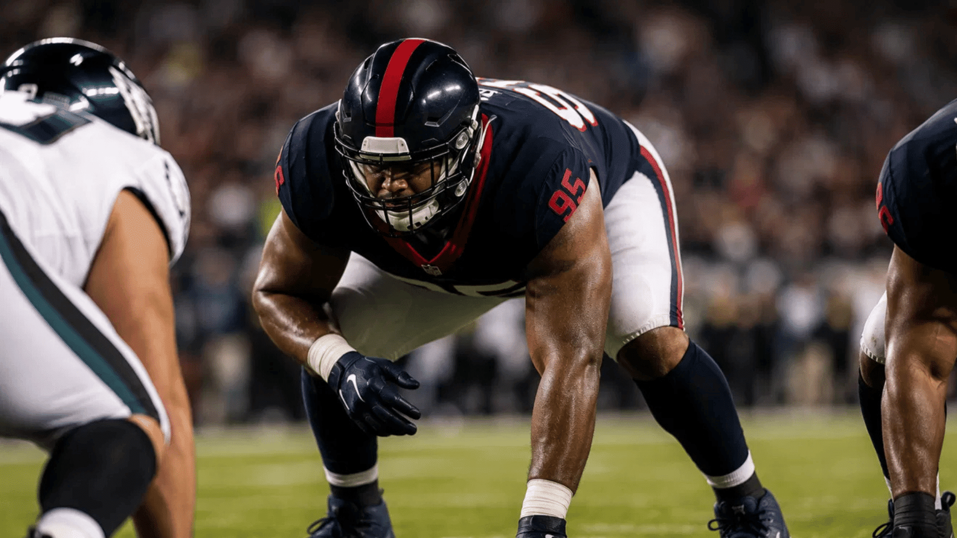 texans defensive tackle number 95 lined up at the line of scrimmage facing the eagles