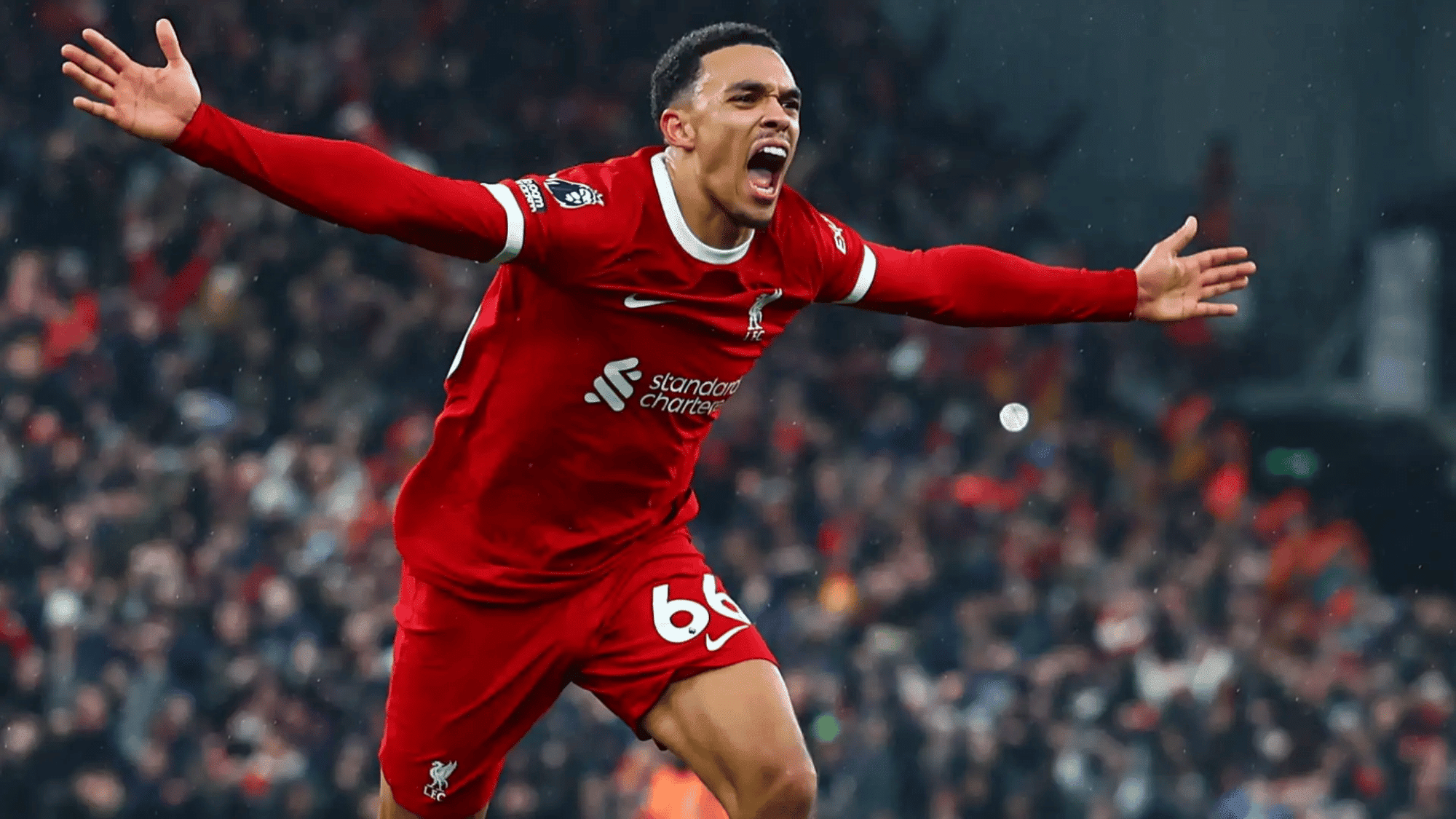 wide angle focus shot on trent alexander arnold celebrating his goal with his arms to the side