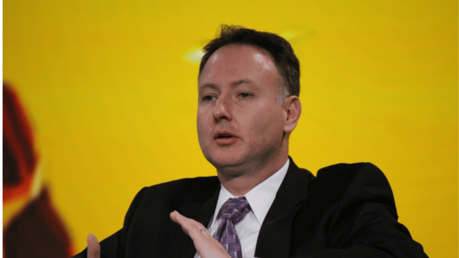 yellow background and man to represent Brian Burke and the rise of advanced football math