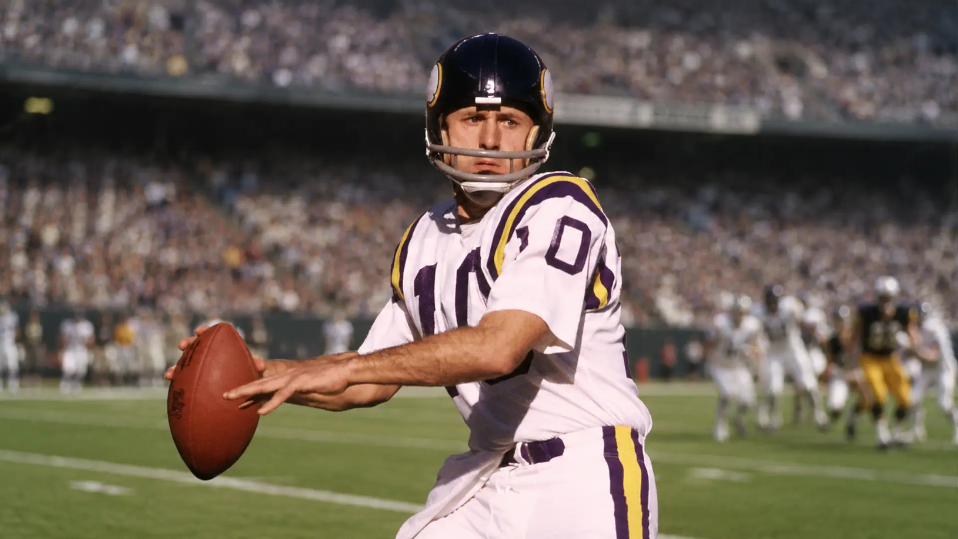 fran tarkenton prepares to throw a football while playing quarterback for the minnesota vikings