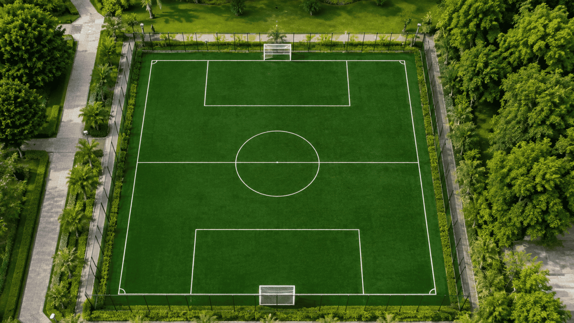 aerial view of a 7v7 soccer field showing goals penalty areas center circle and full field markings