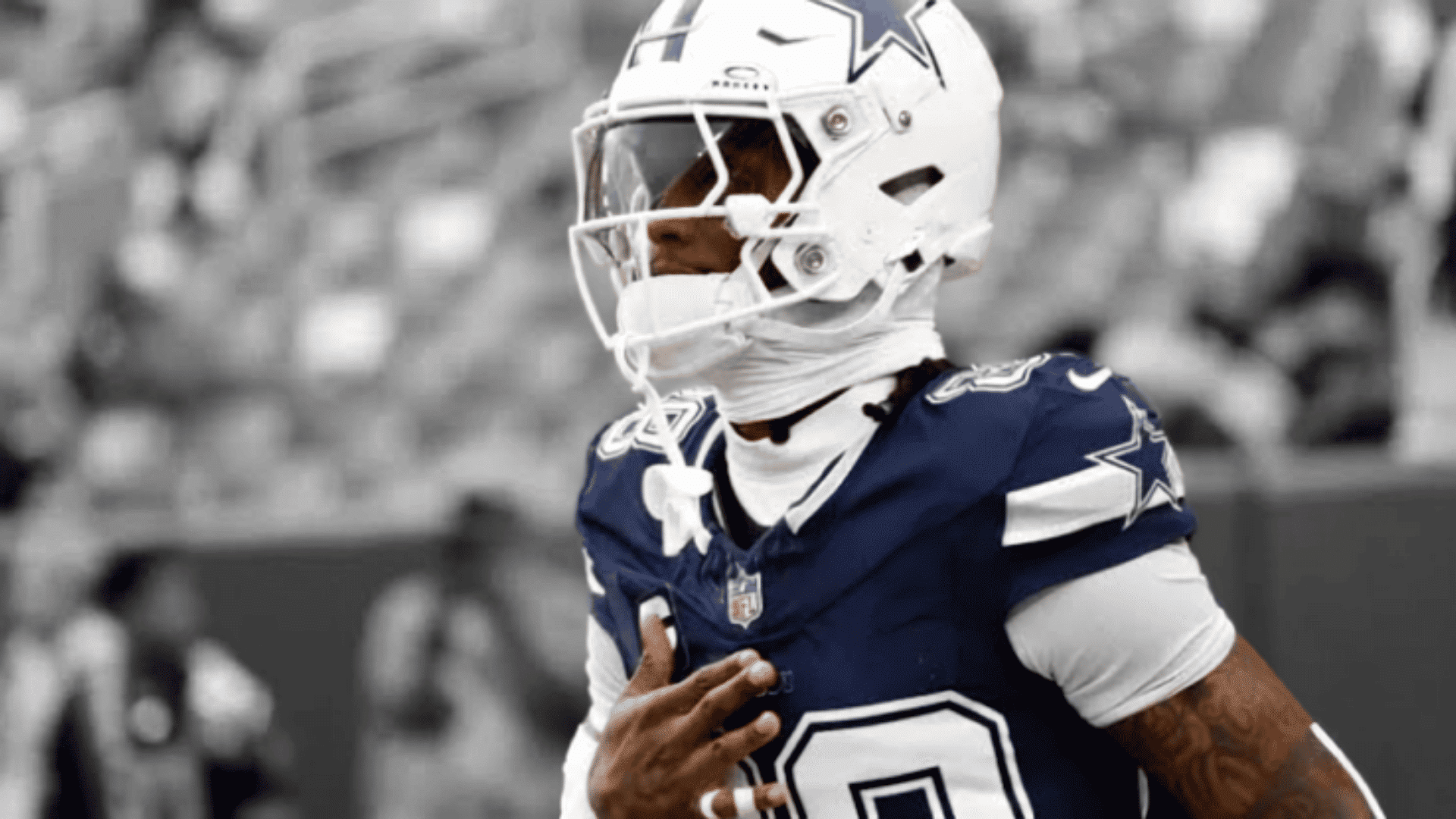 cowboys wide receiver number eighty eight celebrating in a navy uniform