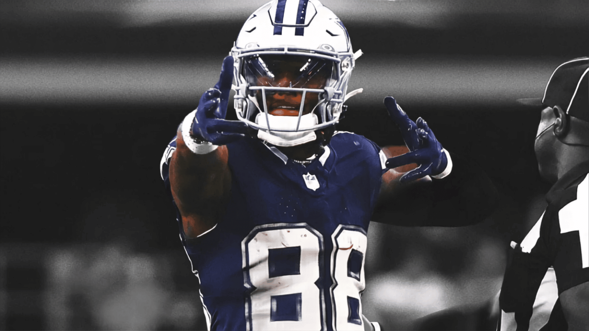 dallas cowboys player number eighty eight celebrating with both arms raised