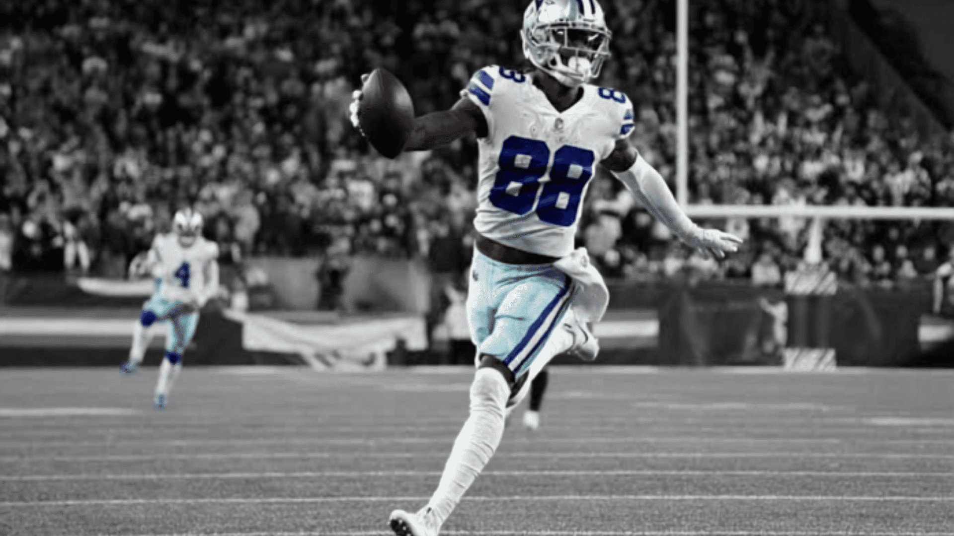 dallas cowboys player running with the football in open field