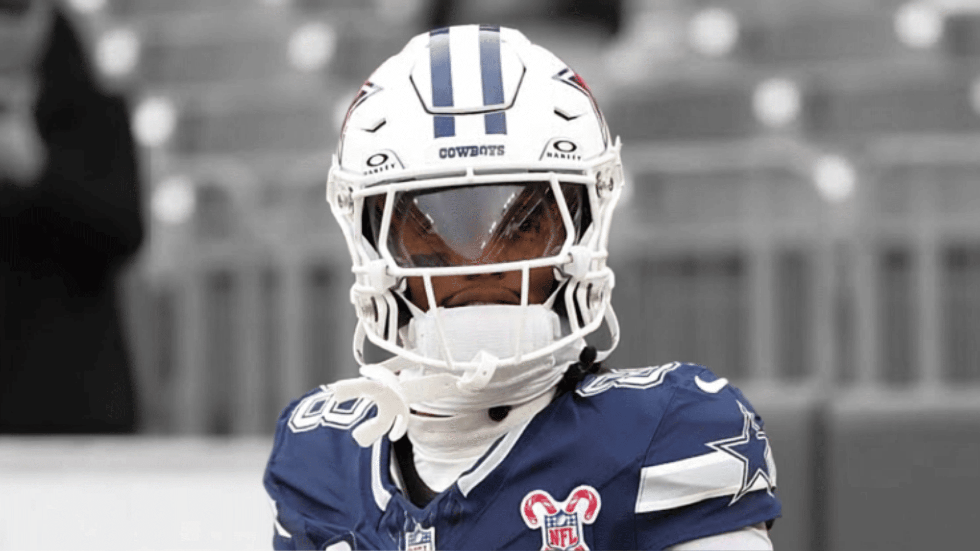 cowboys number eighty eight wearing a navy jersey and looking across the field