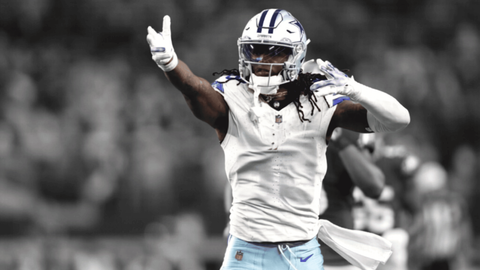close up of a dallas cowboys receiver wearing a helmet and white uniform