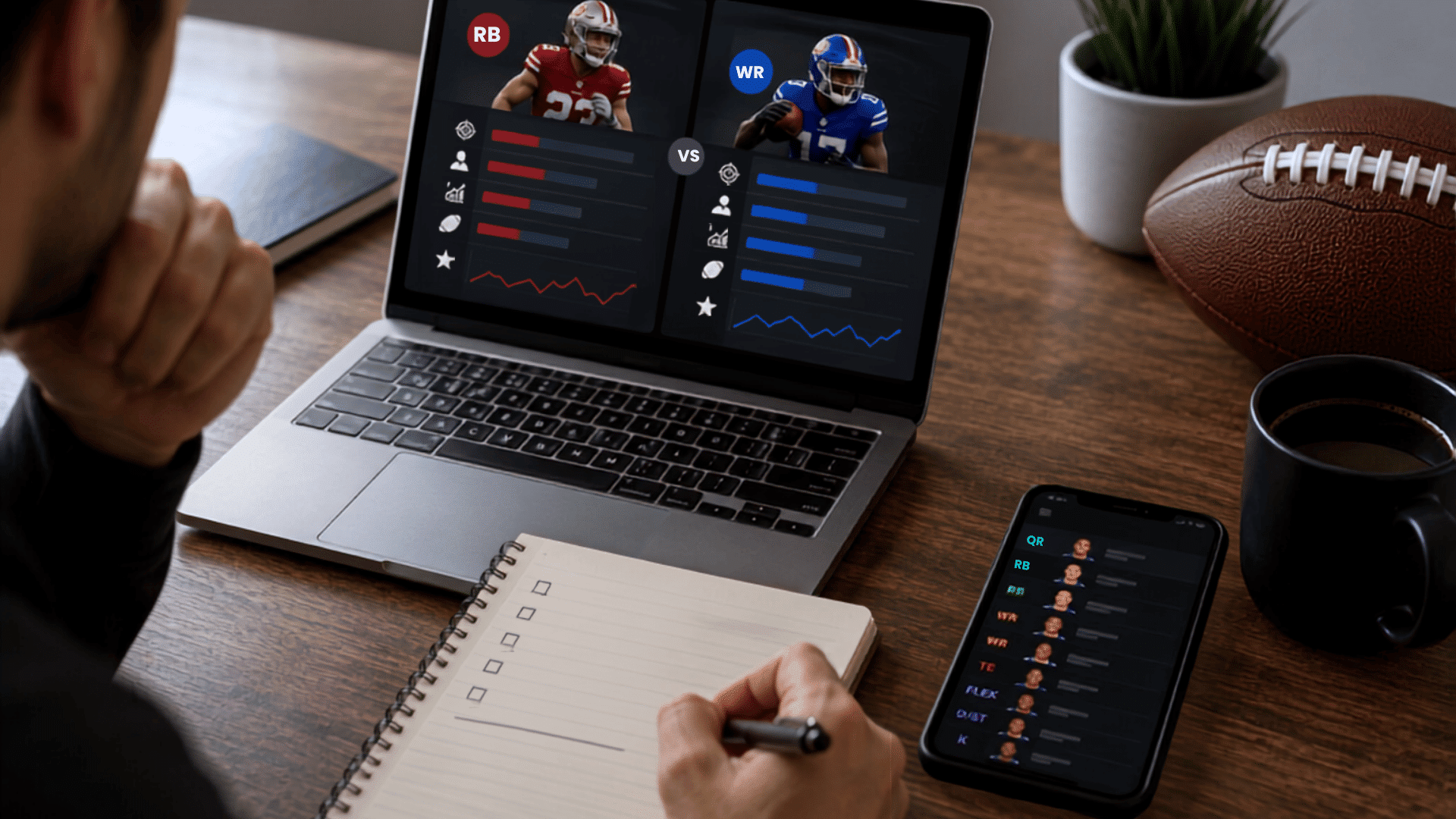 fantasy football manager comparing running back and wide receiver trade values on laptop beside notes
